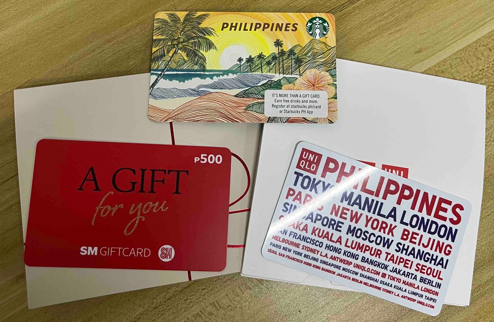 Physical Starbucks, SM, and Uniqlo gift cards stocked for the digital gashapon prize